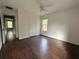 Bedroom with dark wood floors and access to hallway at 166 Greentree Trl, Temple, GA 30179