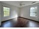 Simple bedroom with wood floors and two windows at 166 Greentree Trl, Temple, GA 30179