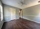 Bright bedroom featuring wood floors and ceiling fan at 166 Greentree Trl, Temple, GA 30179