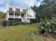 Two-story house with a wraparound porch and a landscaped yard at 166 Greentree Trl, Temple, GA 30179