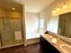 Bathroom with double sinks, soaking tub, and walk-in shower at 3909 Makeover Ct, Atlanta, GA 30349