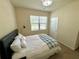 Bright bedroom with a queen bed and plenty of natural light at 3909 Makeover Ct, Atlanta, GA 30349