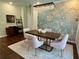 Elegant dining room with statement wallpaper and modern light fixture at 3909 Makeover Ct, Atlanta, GA 30349