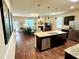 Open kitchen with island, stainless steel appliances, and granite countertops at 3909 Makeover Ct, Atlanta, GA 30349