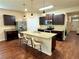 Modern kitchen with island, granite countertops, and dark cabinetry at 3909 Makeover Ct, Atlanta, GA 30349