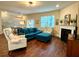 Spacious living room with fireplace, hardwood floors, and large windows at 3909 Makeover Ct, Atlanta, GA 30349
