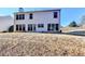 Back of house with large windows and patio at 1931 Abinger Way, Lawrenceville, GA 30043