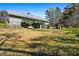 Large backyard view of a two-story home with a private outdoor deck at 239 Cedar Ridge Dr, Dallas, GA 30157