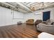 Spacious finished basement with wood floors, media area and comfortable seating at 239 Cedar Ridge Dr, Dallas, GA 30157