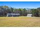 Quaint ranch-style home featuring a sprawling lawn and detached outbuilding for added space at 239 Cedar Ridge Dr, Dallas, GA 30157