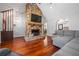 Inviting living room features stone fireplace and hardwood floors, creating a cozy ambiance at 239 Cedar Ridge Dr, Dallas, GA 30157