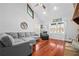 Cozy living room featuring hardwood floors, and a comfortable sectional sofa with vaulted ceiling at 239 Cedar Ridge Dr, Dallas, GA 30157