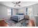 Calm main bedroom with hardwood floors, natural light, and neutral tones, creating a cozy retreat at 239 Cedar Ridge Dr, Dallas, GA 30157