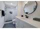 Updated bathroom with glass shower, modern vanity, and stylish fixtures at 3178 Berrong Way, Stone Mountain, GA 30087