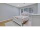 Bright bedroom featuring laminate floors and natural light at 3178 Berrong Way, Stone Mountain, GA 30087