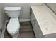 Clean bathroom with white toilet and marbled countertop at 6146 Douglas Manor Ct, Douglasville, GA 30134