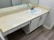 Bathroom vanity with a white sink and beige countertop at 6146 Douglas Manor Ct, Douglasville, GA 30134