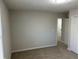 Simple bedroom with neutral walls and carpet at 6146 Douglas Manor Ct, Douglasville, GA 30134