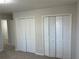 Bright bedroom with double closets and neutral walls at 6146 Douglas Manor Ct, Douglasville, GA 30134