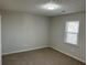 Spacious bedroom with neutral walls and carpet at 6146 Douglas Manor Ct, Douglasville, GA 30134