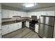 Modern kitchen featuring stainless steel appliances and granite countertops at 6146 Douglas Manor Ct, Douglasville, GA 30134