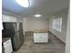Eat-in kitchen with granite island and new flooring at 6146 Douglas Manor Ct, Douglasville, GA 30134