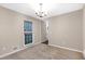 Spacious dining room with neutral wall colors and large windows at 818 Victoria Pl, Woodstock, GA 30189