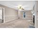 Spacious living room featuring a fireplace and neutral carpeting at 818 Victoria Pl, Woodstock, GA 30189