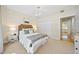 Cozy bedroom with a wooden headboard and view into kitchen at 3636 Habersham Nw Rd # 1108, Atlanta, GA 30305