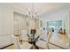 Bright dining room with glass table and four chairs, open to living area at 3636 Habersham Nw Rd # 1108, Atlanta, GA 30305