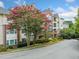 Brick building exterior with landscaping and gated entrance at 3636 Habersham Nw Rd # 1108, Atlanta, GA 30305