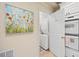 Small laundry room with stackable washer and dryer at 3636 Habersham Nw Rd # 1108, Atlanta, GA 30305