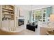 Bright living room with fireplace, built-ins, and large windows at 3636 Habersham Nw Rd # 1108, Atlanta, GA 30305