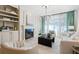 Elegant living room with fireplace, built-ins, and large windows at 3636 Habersham Nw Rd # 1108, Atlanta, GA 30305