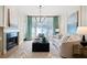 Living room boasts a fireplace and large windows with a view at 3636 Habersham Nw Rd # 1108, Atlanta, GA 30305