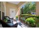 Private patio with wicker furniture and lush greenery at 3636 Habersham Nw Rd # 1108, Atlanta, GA 30305