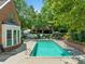 Community pool with plenty of lounge chairs for relaxation at 3636 Habersham Nw Rd # 1108, Atlanta, GA 30305