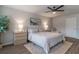 Bright bedroom featuring a ceiling fan, contemporary decor, and a view of the door at 4480 Sunflower Cir, Cumming, GA 30040