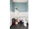 Clean bathroom with white subway tile and dark grey floor at 9057 Selborne Ln, Chattahoochee Hills, GA 30268