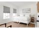Bedroom with queen-size bed, neutral decor and window seating at 9057 Selborne Ln, Chattahoochee Hills, GA 30268