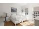 Bedroom with a queen-size bed, neutral color palette, and access to a balcony at 9057 Selborne Ln, Chattahoochee Hills, GA 30268