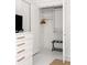 Walk-in closet with shelving and hanging rods at 9057 Selborne Ln, Chattahoochee Hills, GA 30268