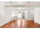 Spacious living area with hardwood floors and abundant natural light at 9057 Selborne Ln, Chattahoochee Hills, GA 30268