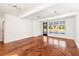 Spacious living area with hardwood floors and abundant natural light at 9057 Selborne Ln, Chattahoochee Hills, GA 30268