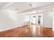 Spacious living area with hardwood floors and abundant natural light at 9057 Selborne Ln, Chattahoochee Hills, GA 30268