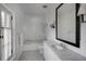 Bathroom featuring a classic black and white mosaic floor, subway tiled shower, and marble vanity at 133 Blackland Nw Rd, Atlanta, GA 30342