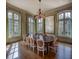 Bright dining room with large windows, hardwood floors and elegant table setting for memorable gatherings at 133 Blackland Nw Rd, Atlanta, GA 30342