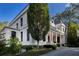 Elegant home showing sophisticated architecture, landscaping and driveway with verdant plantings, showing great curb appeal at 133 Blackland Nw Rd, Atlanta, GA 30342
