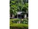 Lovely home exterior featuring a beautiful lawn and manicured hedges and gardens at 133 Blackland Nw Rd, Atlanta, GA 30342