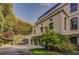 A secluded multi-car garage with lush greenery providing a private driveway for this stunning luxury home at 133 Blackland Nw Rd, Atlanta, GA 30342